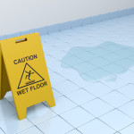 wet floor caution sign on tiled floor wet floor caution sign on tiled floor