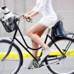 Side shot of woman on bike Side shot of woman on bike