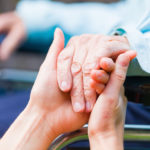 Young carer giving helping hands for the elderly woman Young carer giving helping hands for the elderly woman
