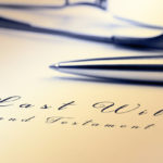 Last will and testament with pen and reading glasses. Last will and testament with pen and reading glasses.