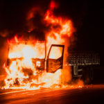 Burning truck on the highway Burning truck on the highway