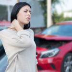 Injured woman needs first aid emergency after car crash Injured woman needs first aid emergency after car crash