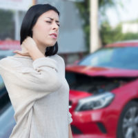 Injured woman needs first aid emergency after car crash Injured woman needs first aid emergency after car crash