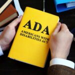Americans with Disabilities Act ADA law on the wooden surface. Americans with Disabilities Act ADA law on the wooden surface.