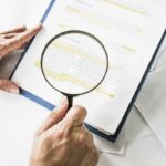 Legal team checking the fine print on business contract to analyze terms and conditions and sign. Legal team checking the fine print on business contract to analyze terms and conditions and sign.
