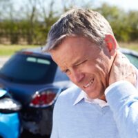 Driver Suffering From Whiplash After Traffic Collision Driver Suffering From Whiplash After Traffic Collision